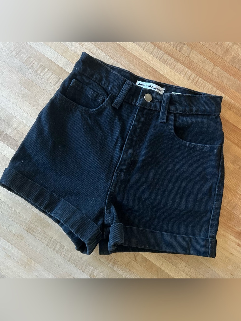 American Apparel High-Waist Denim Cuff Shorts in black.